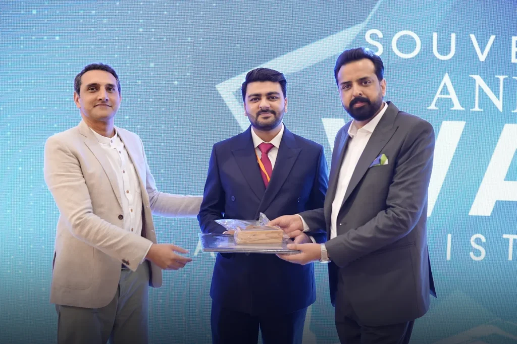 Umar Hameed on stage with two other men at a Connected Pakistan event